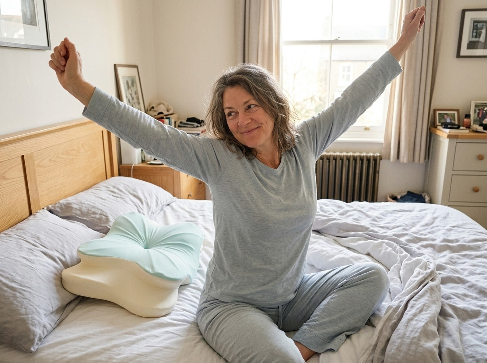 Woman stretching in bed in the morning