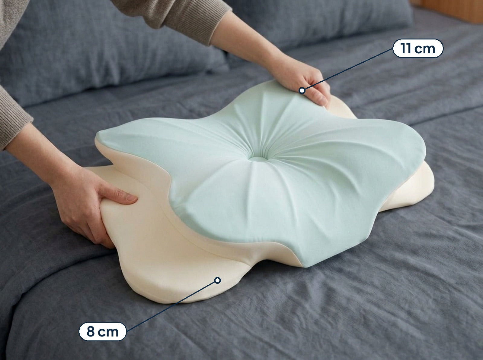 A hand turning the pillow to show the two heights